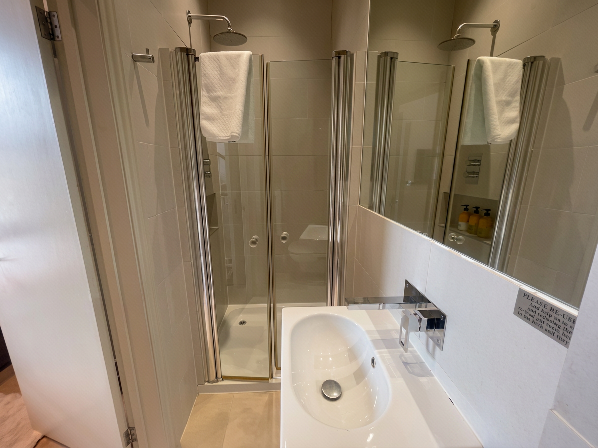 Hastings House ensuite shower room with rainfall shower