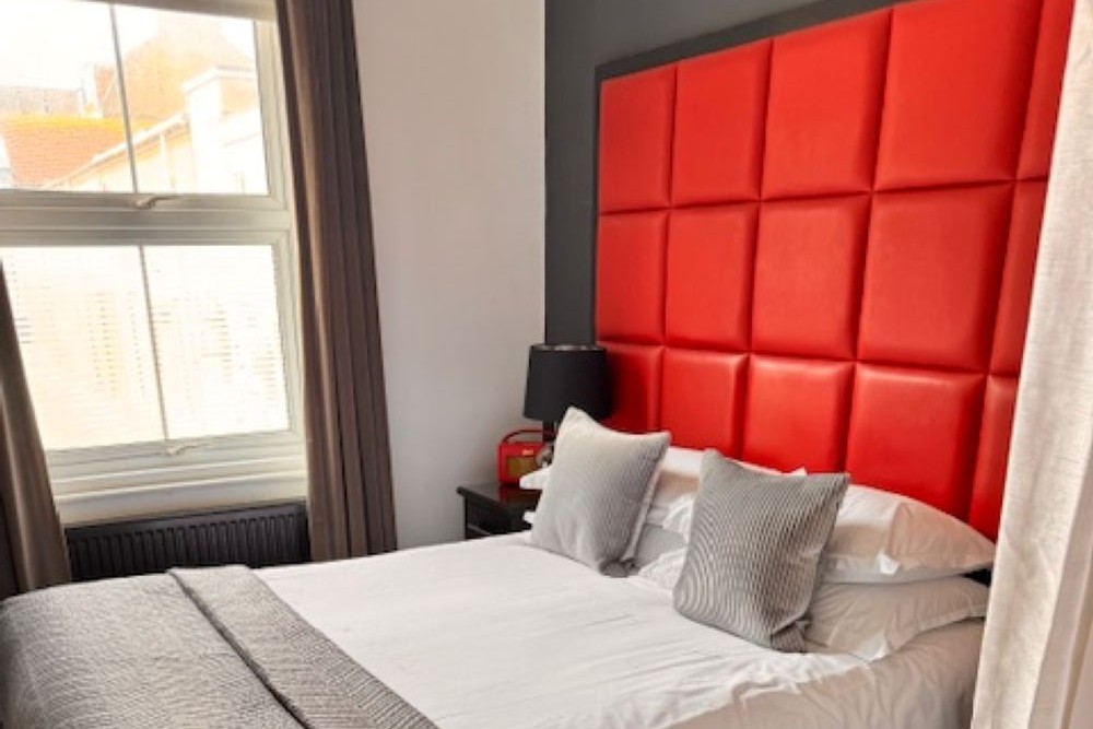 Hastings House red bedroom with bold headboard