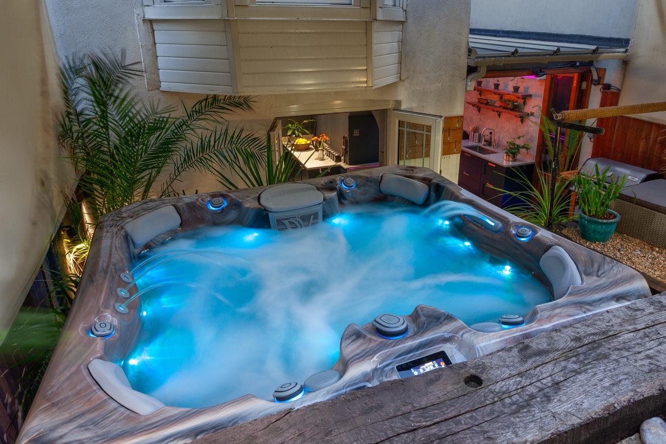 Zanzibar House — courtyard hot tub lit up at night, St Leonards-on-Sea